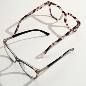 A pair of stylish eyeglasses and sunglasses displayed on a white background.